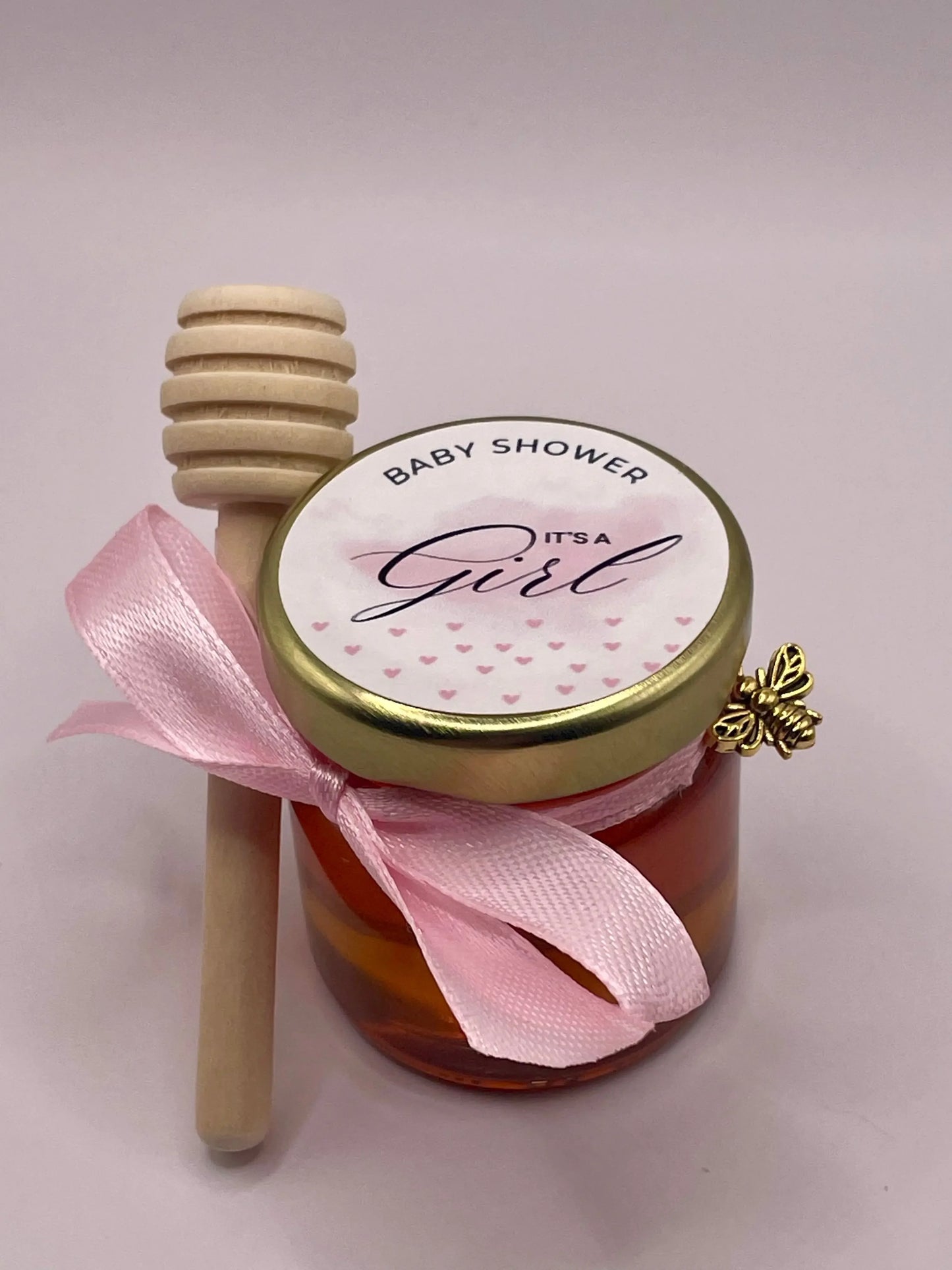Petit pot de miel personnalisé pour baby shower 'It's a Girl', avec ruban rose et cuillère en bois
